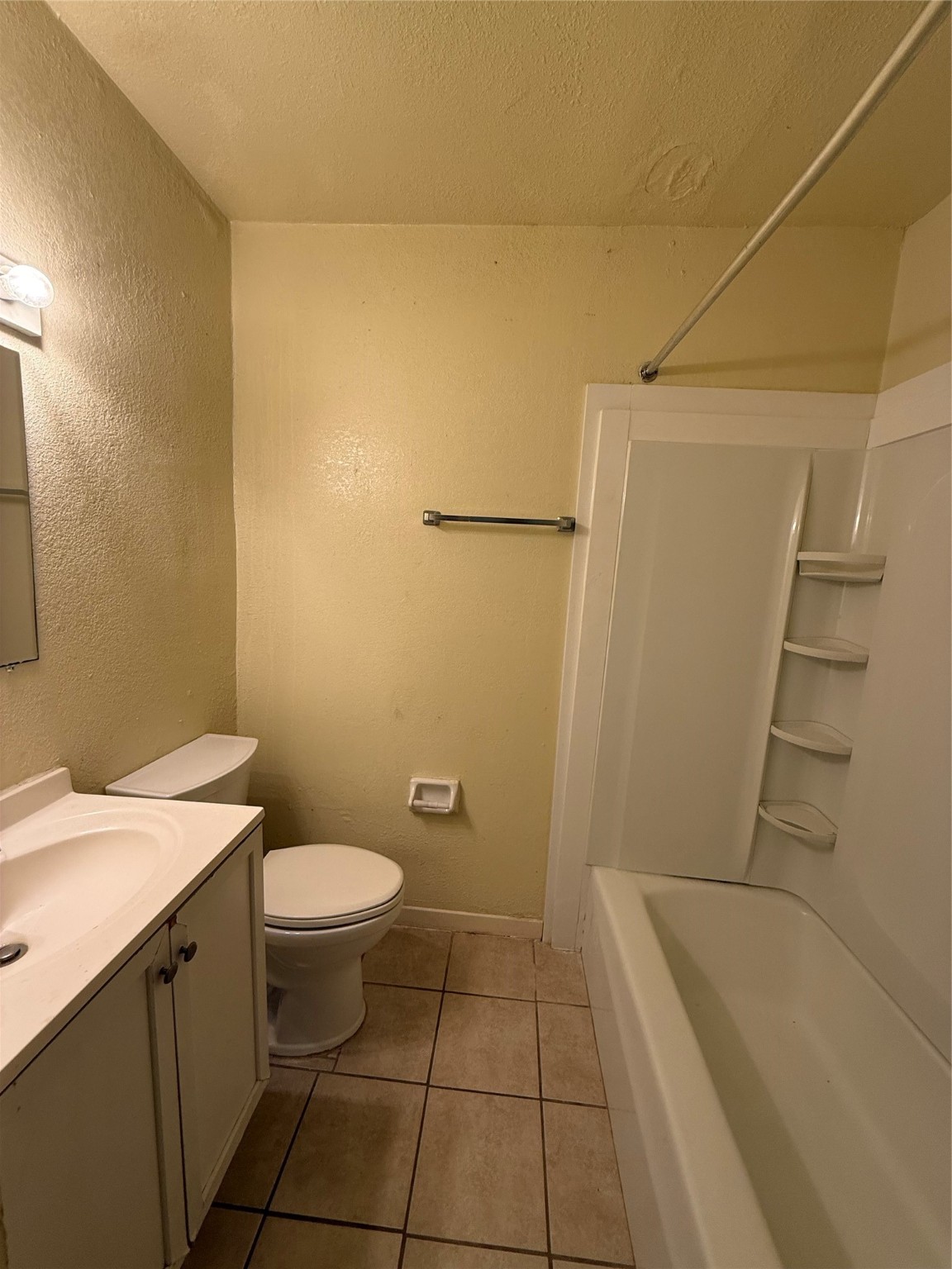 3502 Campbell Street, Unit 2 Houston, TX 77026 - Photo 13 of 14 a bathroom with a sink a toilet and tub