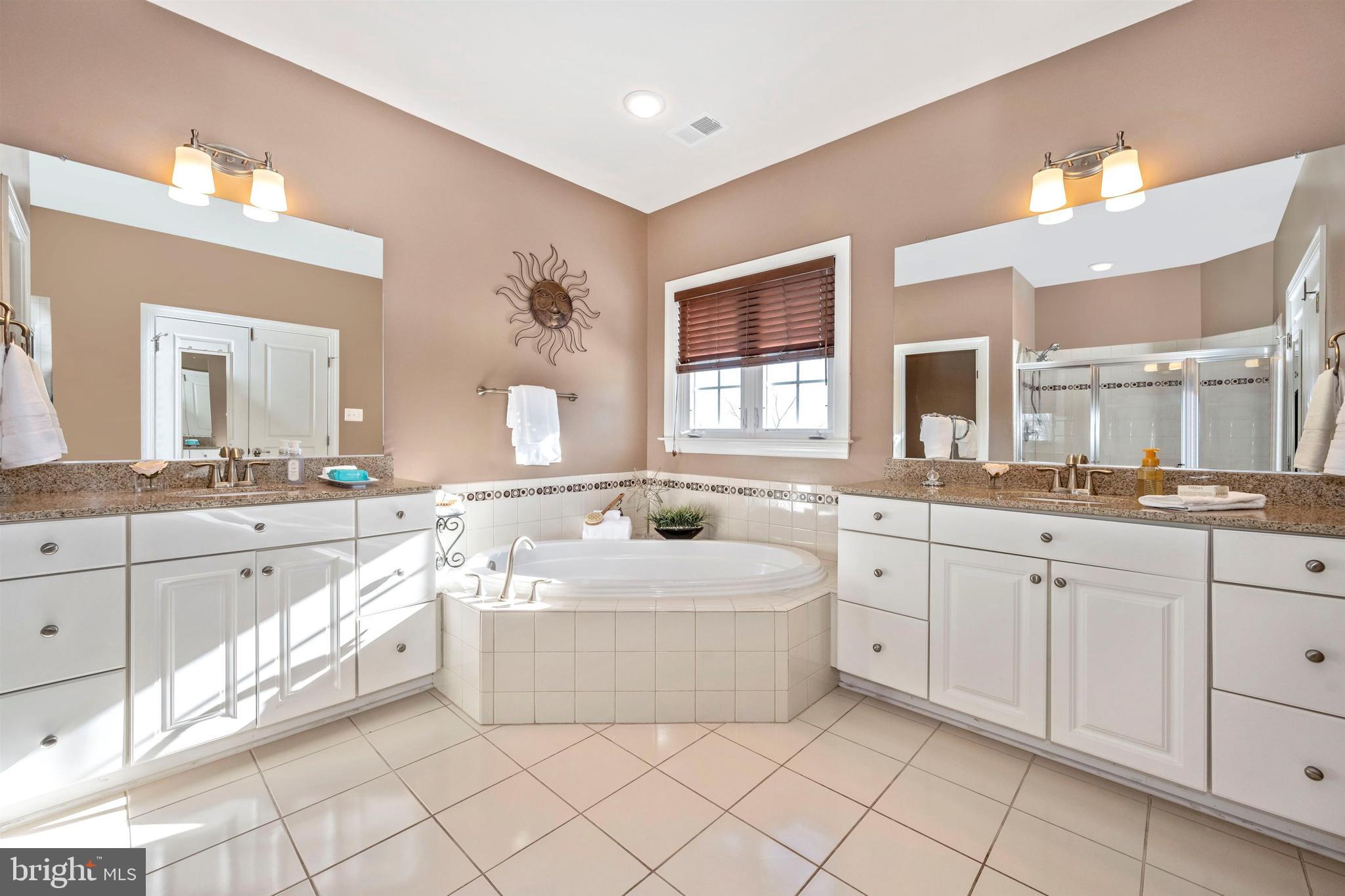 23410 Kimblehunt Place Gaithersburg, MD 20882 - Photo 35 of 72 Dual sinks with cultured marble vanities.