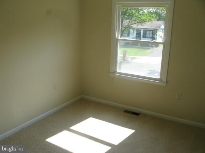 5618 Westgate Road Lanham, MD 20706 - Photo 6 of 17 an empty room with a window
