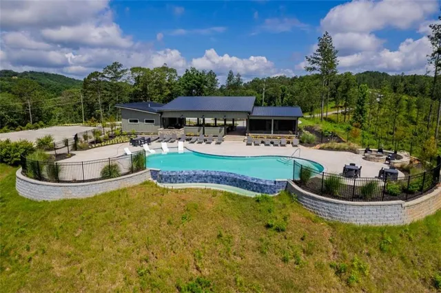 a view of a swimming pool with a patio