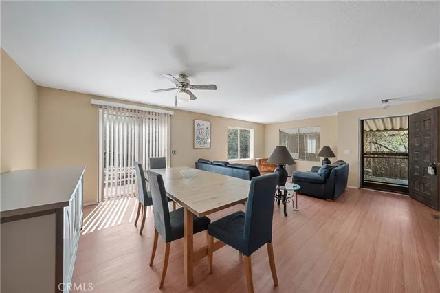 a view of a dining room with furniture window and wooden floor