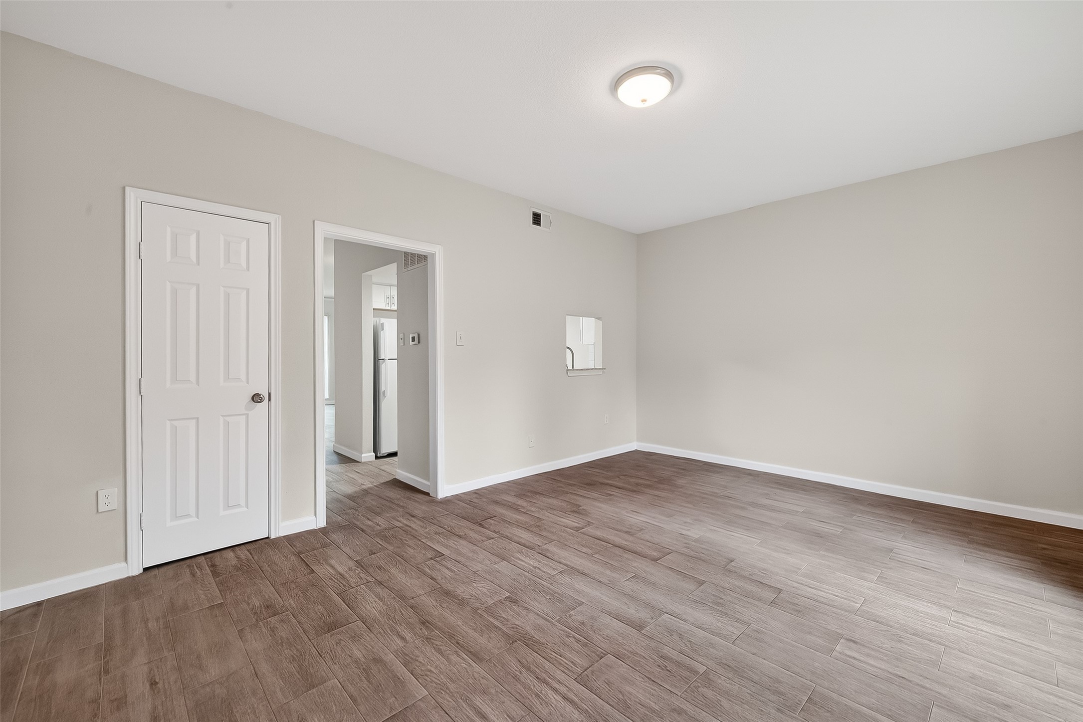 811 Threadneedle Street, Unit 258 Houston, TX 77079 - Photo 23 of 39 a view of an empty room with wooden floor