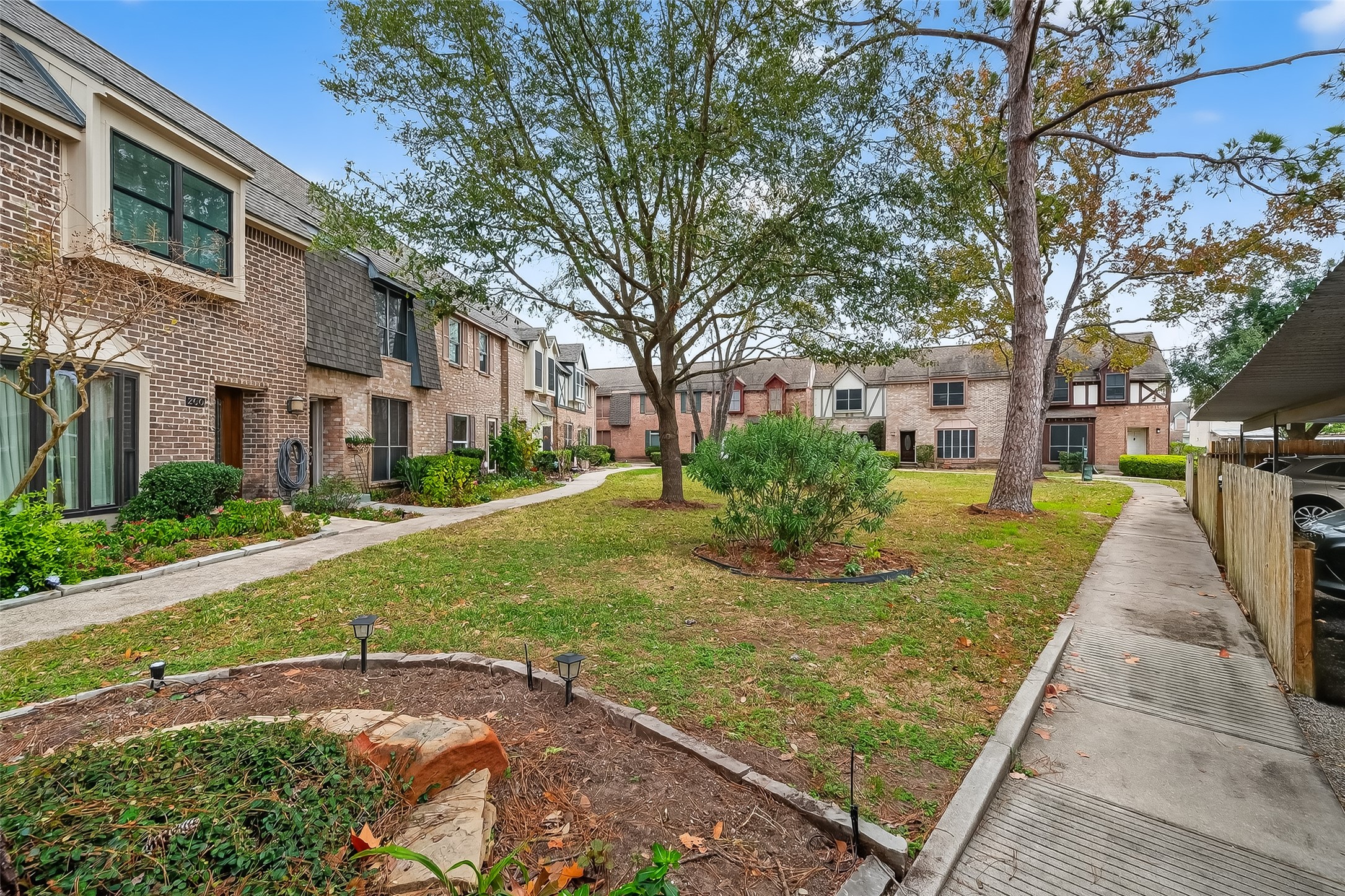 811 Threadneedle Street, Unit 258 Houston, TX 77079 - Photo 5 of 39 a view of a yard with plants and trees
