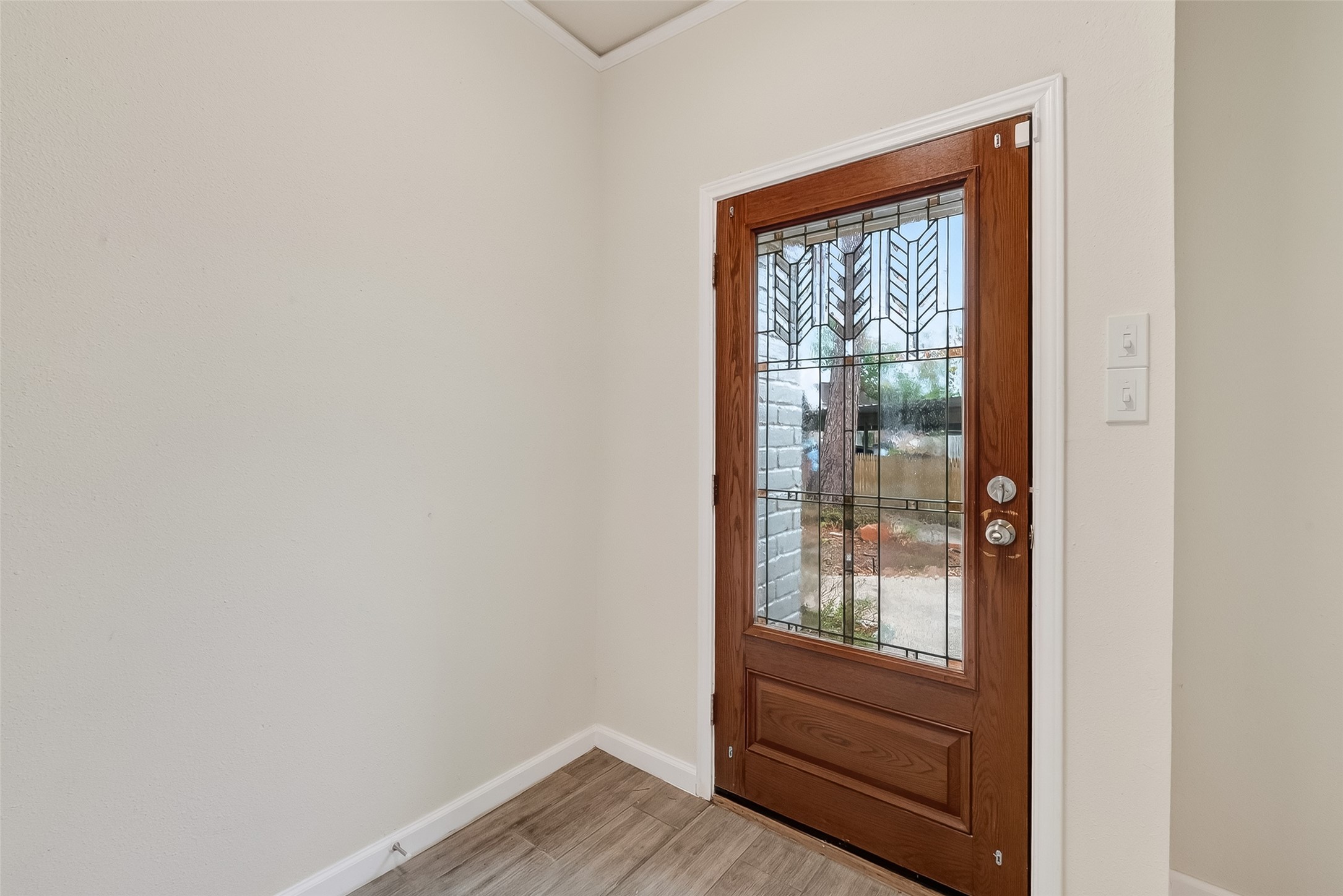 811 Threadneedle Street, Unit 258 Houston, TX 77079 - Photo 8 of 39 a view of front door with wooden floor