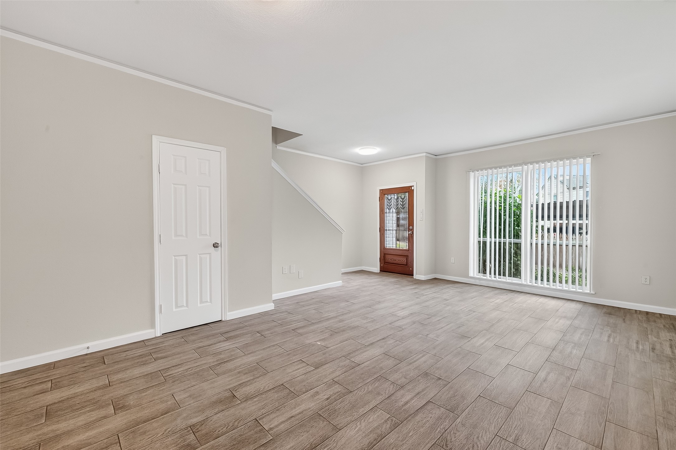 811 Threadneedle Street, Unit 258 Houston, TX 77079 - Photo 10 of 39 a view of a big room with wooden floor and windows
