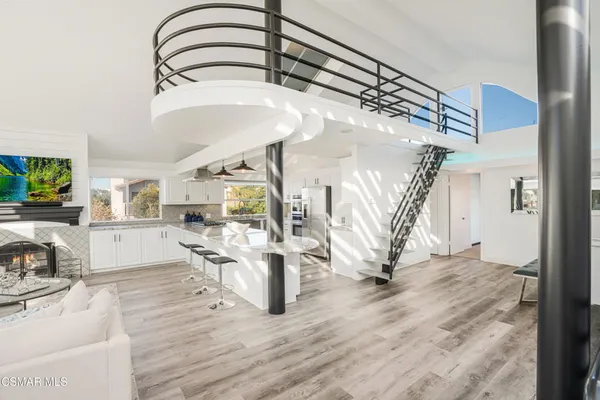 a kitchen with stainless steel appliances a refrigerator sink and cabinets