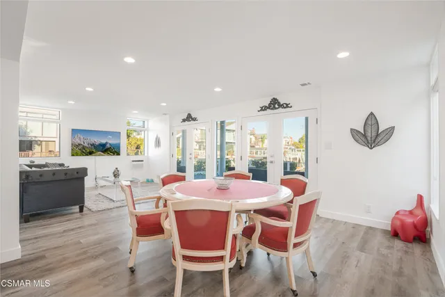 a bathroom with a double vanity sink mirror and toilet