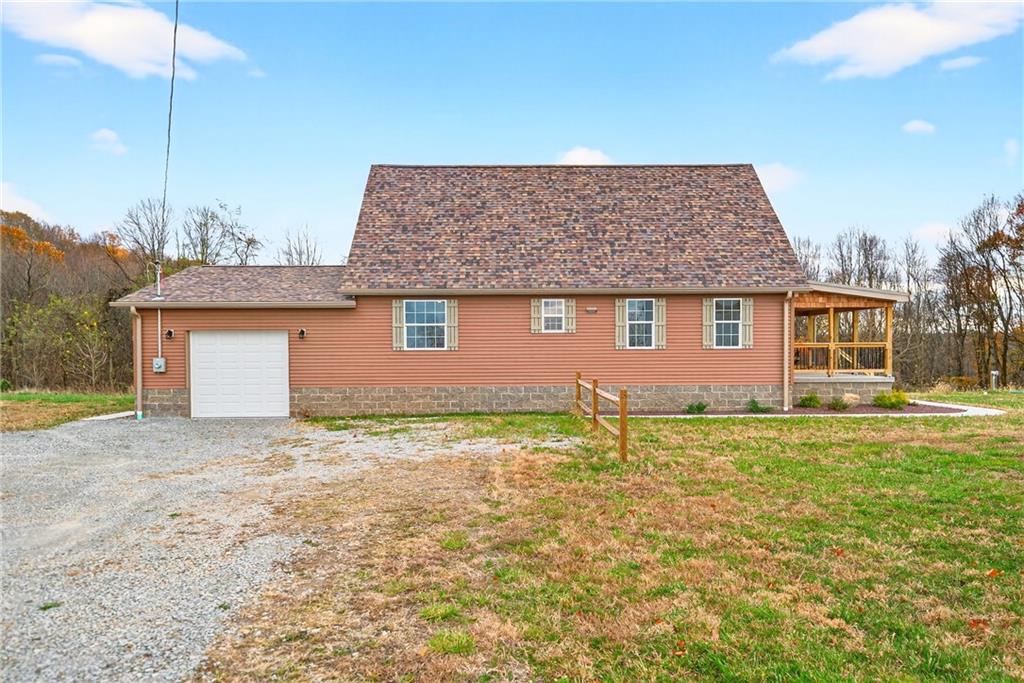 524 Sawmill Road Dawson, PA 15428 - Photo 11 of 50 a front view of a house with garden