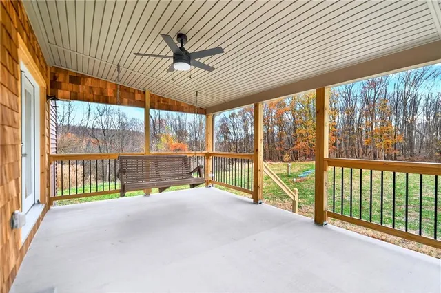 a view of an empty room with a large window