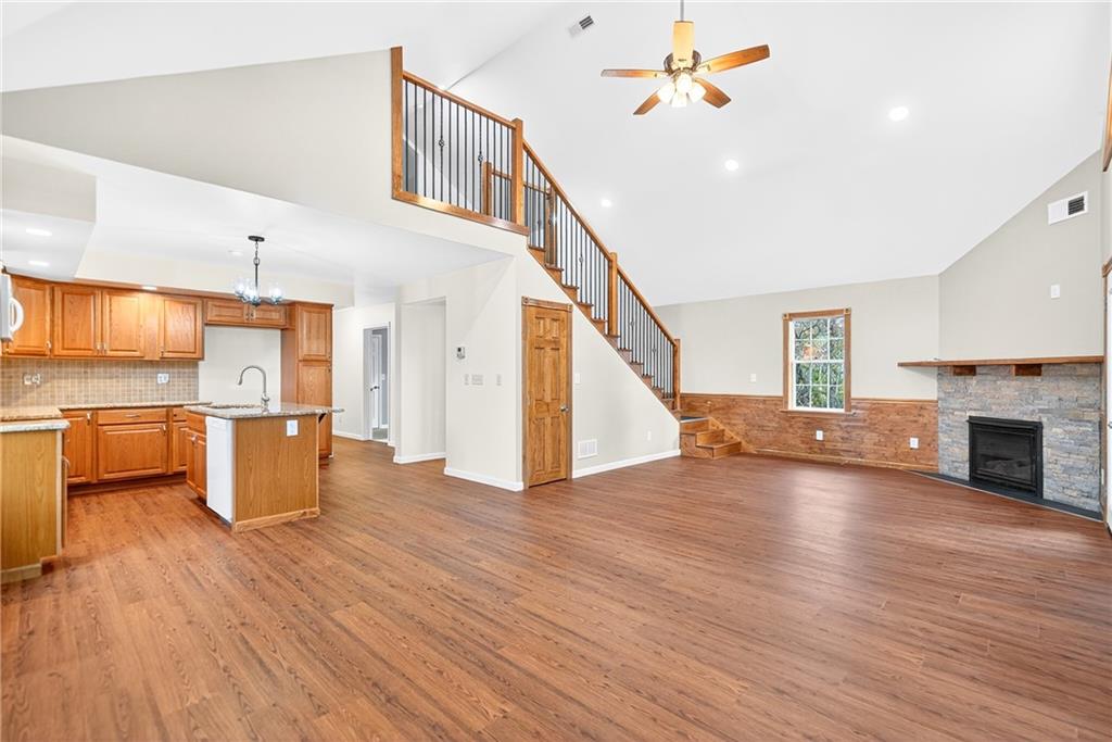 524 Sawmill Road Dawson, PA 15428 - Photo 15 of 50 a living room with fireplace furniture and a wooden floor