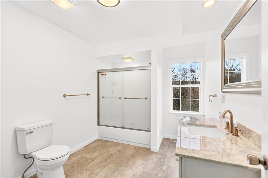 524 Sawmill Road Dawson, PA 15428 - Photo 29 of 50 a bathroom with a granite countertop sink toilet and shower