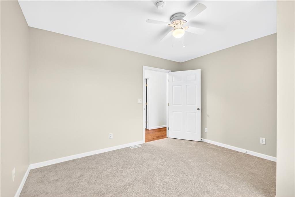 524 Sawmill Road Dawson, PA 15428 - Photo 37 of 50 a view of a room with a ceiling fan and a window