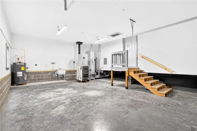 a view of a room with gym equipment and floor to ceiling window