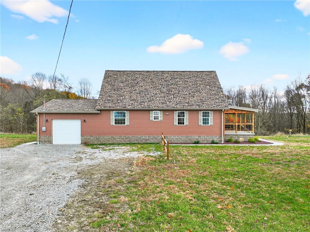 524 Sawmill Road Dawson, PA 15428 - Photo 45 of 50 a front view of a house with garden