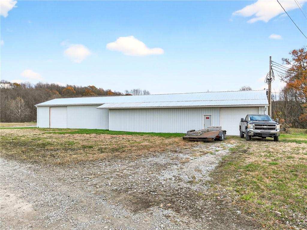524 Sawmill Road Dawson, PA 15428 - Photo 6 of 50 a view of a wooden house with a yard
