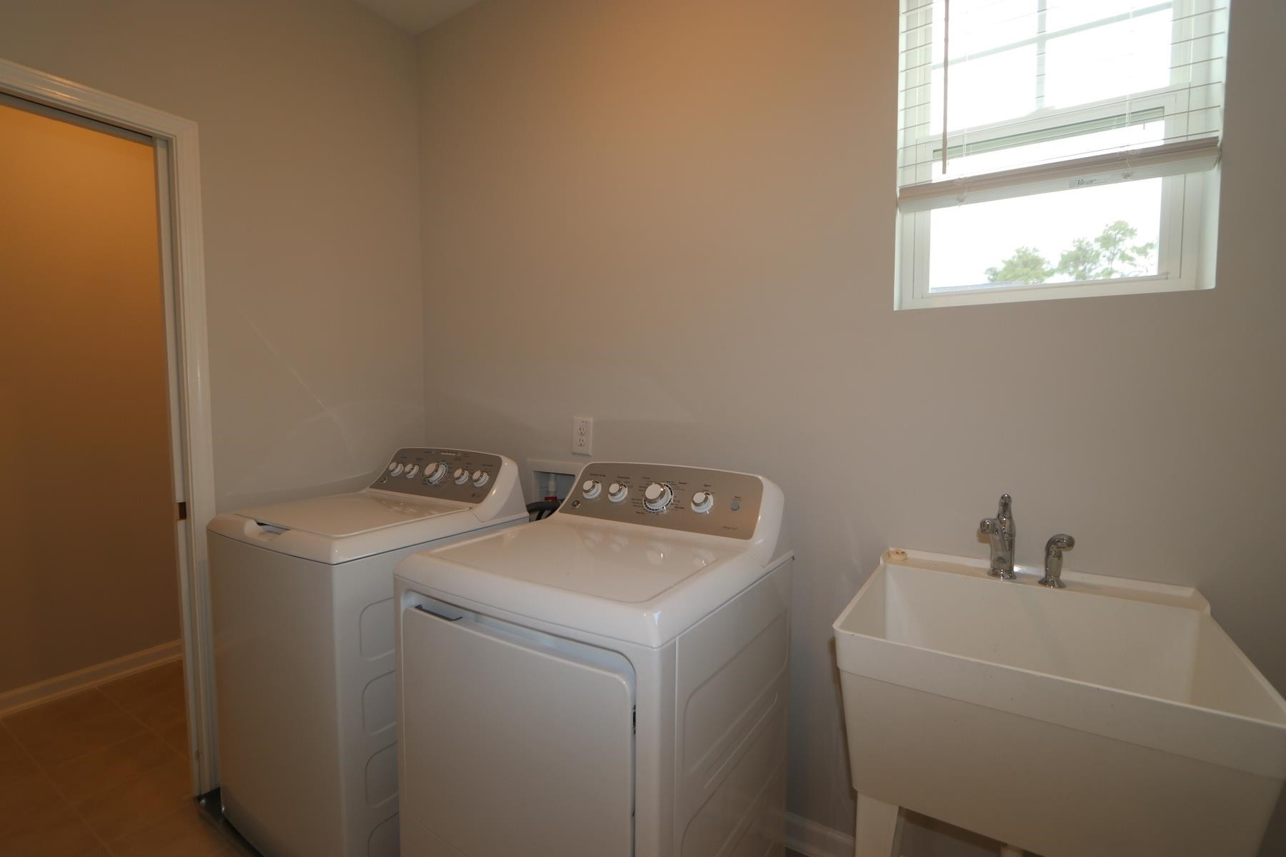 2106 Goudy Drive Raleigh, NC 27615 - Photo 16 of 24 a utility room with dryer and washer