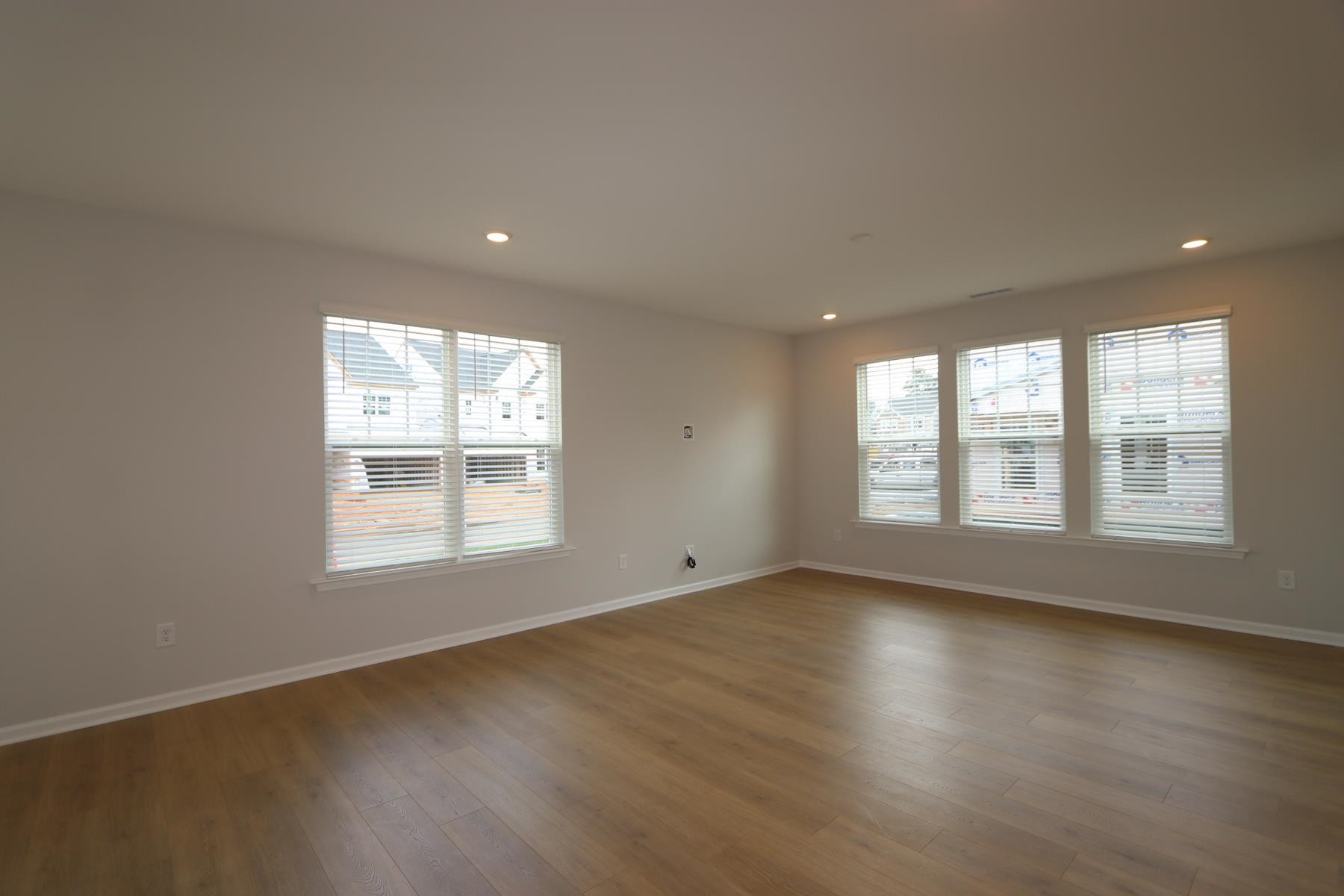 2106 Goudy Drive Raleigh, NC 27615 - Photo 17 of 24 a view of an empty room with wooden floor and a window