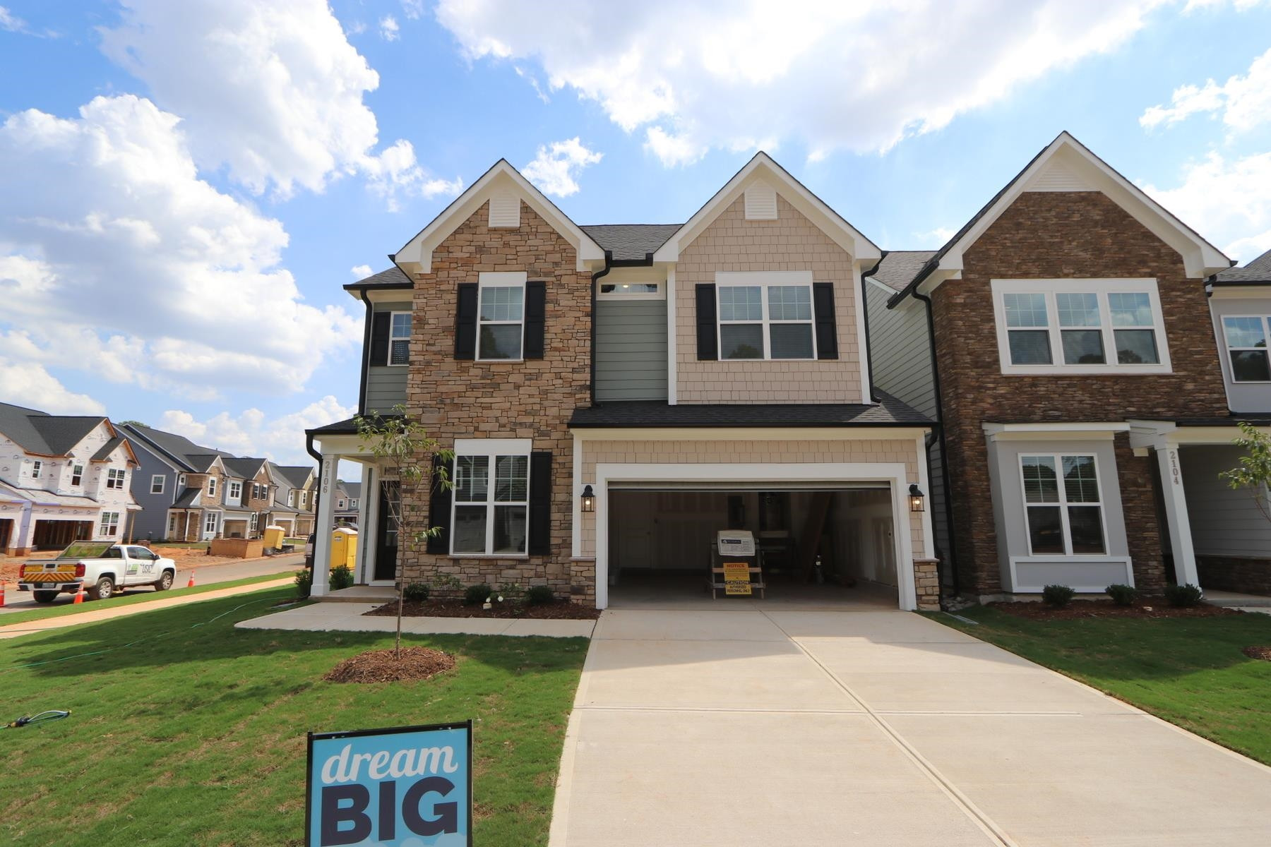 2106 Goudy Drive Raleigh, NC 27615 - Photo 2 of 24 a front view of a house with a garden and yard