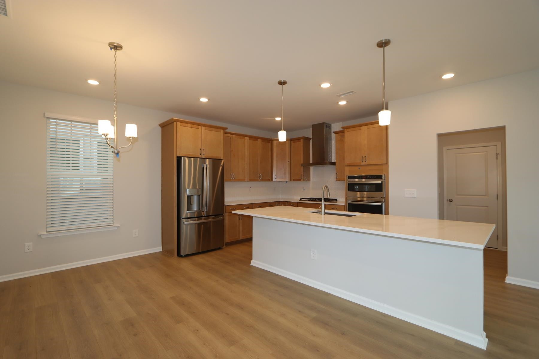 2106 Goudy Drive Raleigh, NC 27615 - Photo 4 of 24 a large kitchen with stainless steel appliances kitchen island a large counter top and a refrigerator