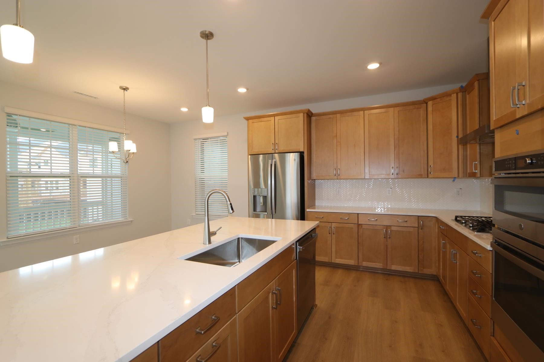 2106 Goudy Drive Raleigh, NC 27615 - Photo 5 of 24 a kitchen with stainless steel appliances granite countertop a sink a stove and a refrigerator