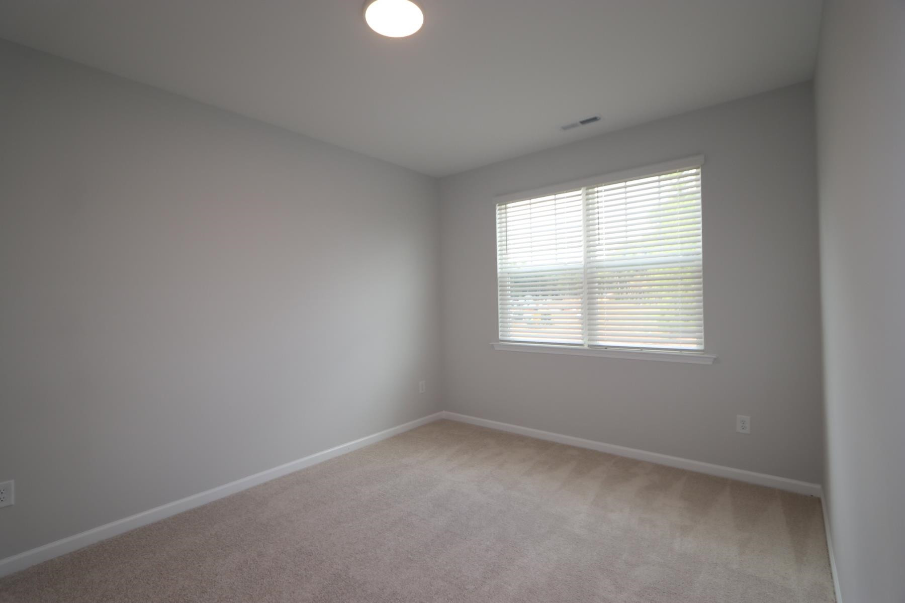2106 Goudy Drive Raleigh, NC 27615 - Photo 7 of 24 an empty room with a window