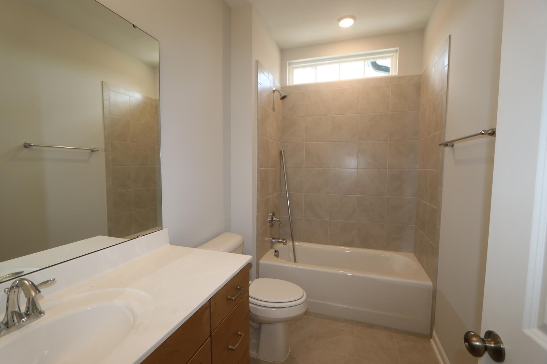 2106 Goudy Drive Raleigh, NC 27615 - Photo 8 of 24 a bathroom with a sink a toilet and shower