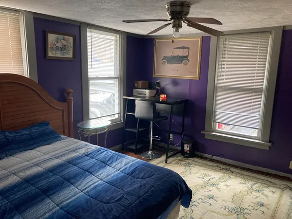 a view of a livingroom with a dishwasher and a window