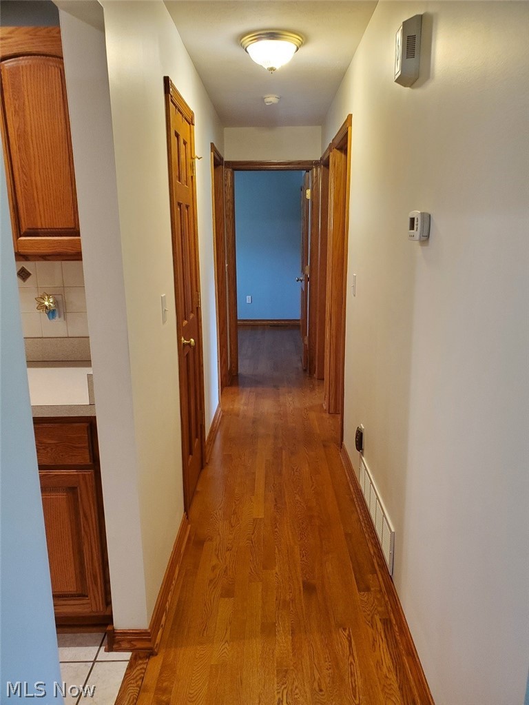 1284 Substation Road Brunswick, OH 44212 - Photo 13 of 26 Hallway with hardwood / wood-style flooring