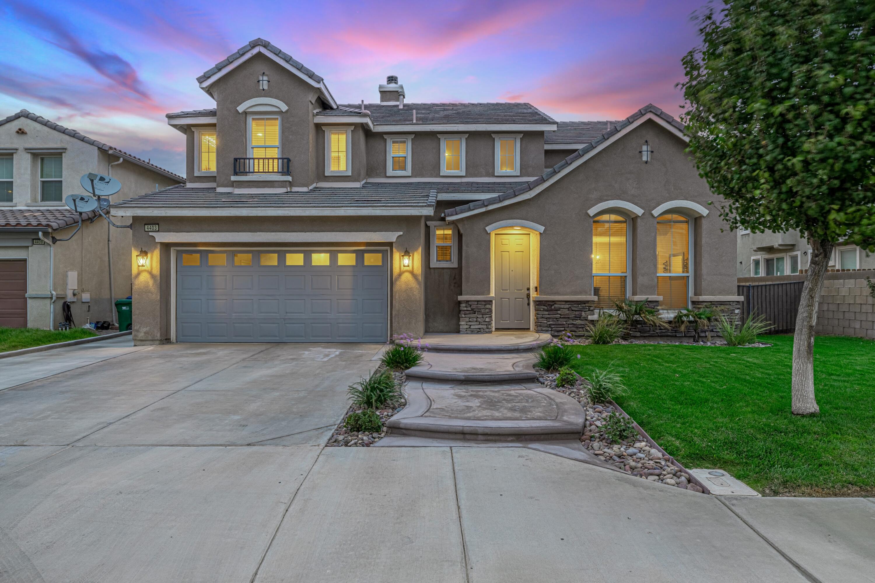 4403 Edam Street Lancaster, CA 93536 - Photo 1 of 42 a front view of a house with garden