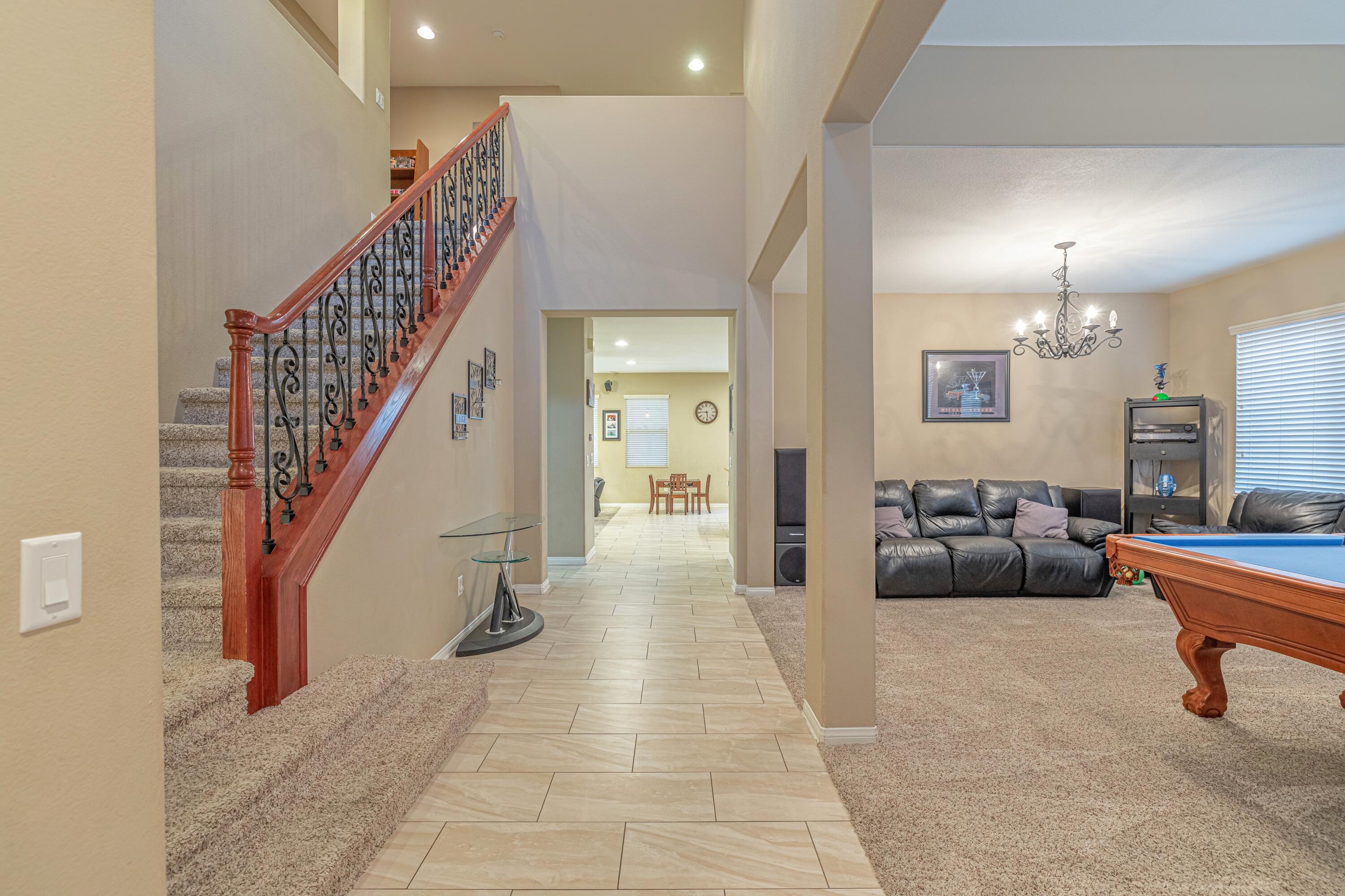 4403 Edam Street Lancaster, CA 93536 - Photo 2 of 42 a view of a livingroom with furniture and stairs