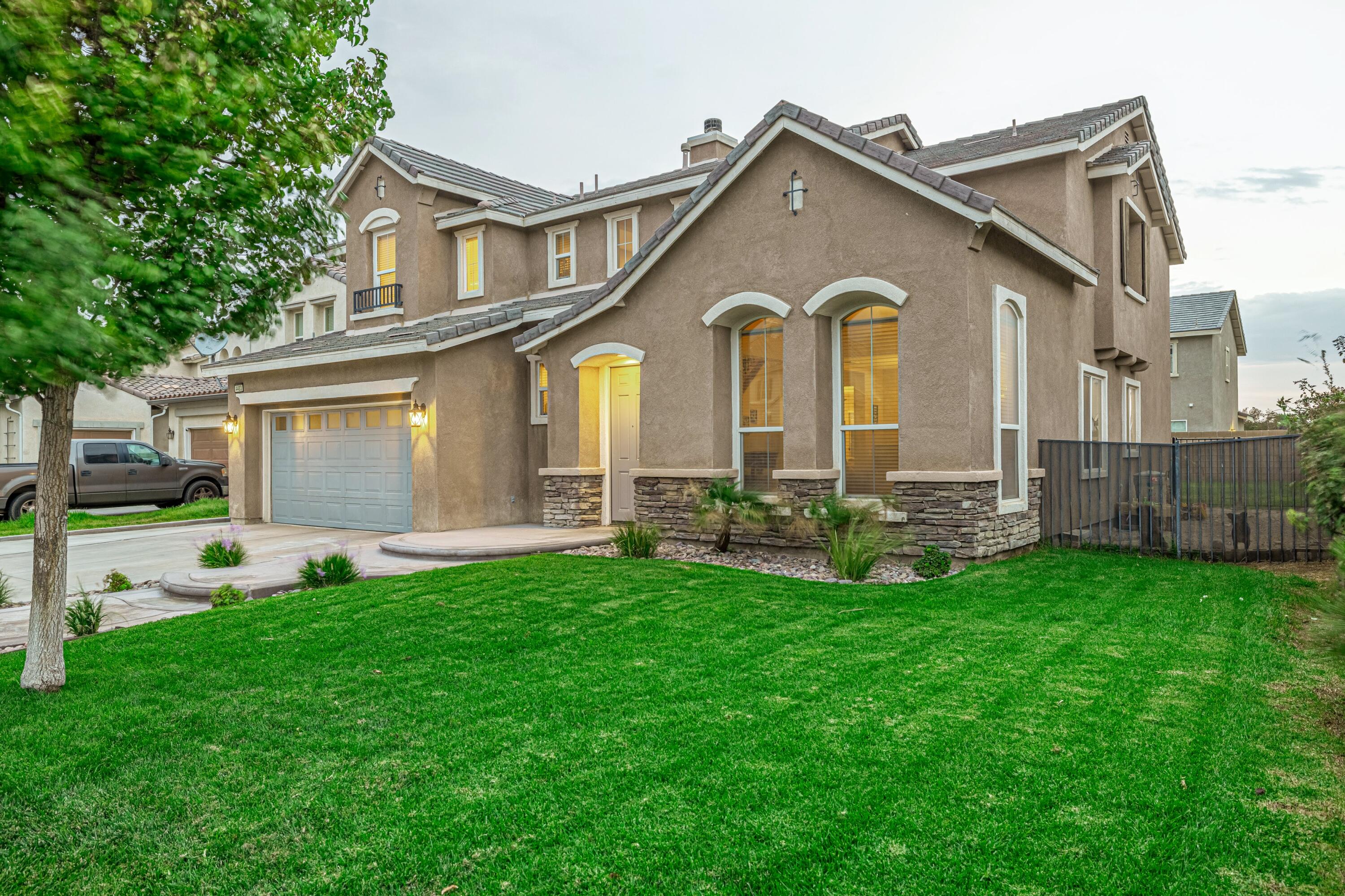 4403 Edam Street Lancaster, CA 93536 - Photo 11 of 42 a front view of house with yard and green space