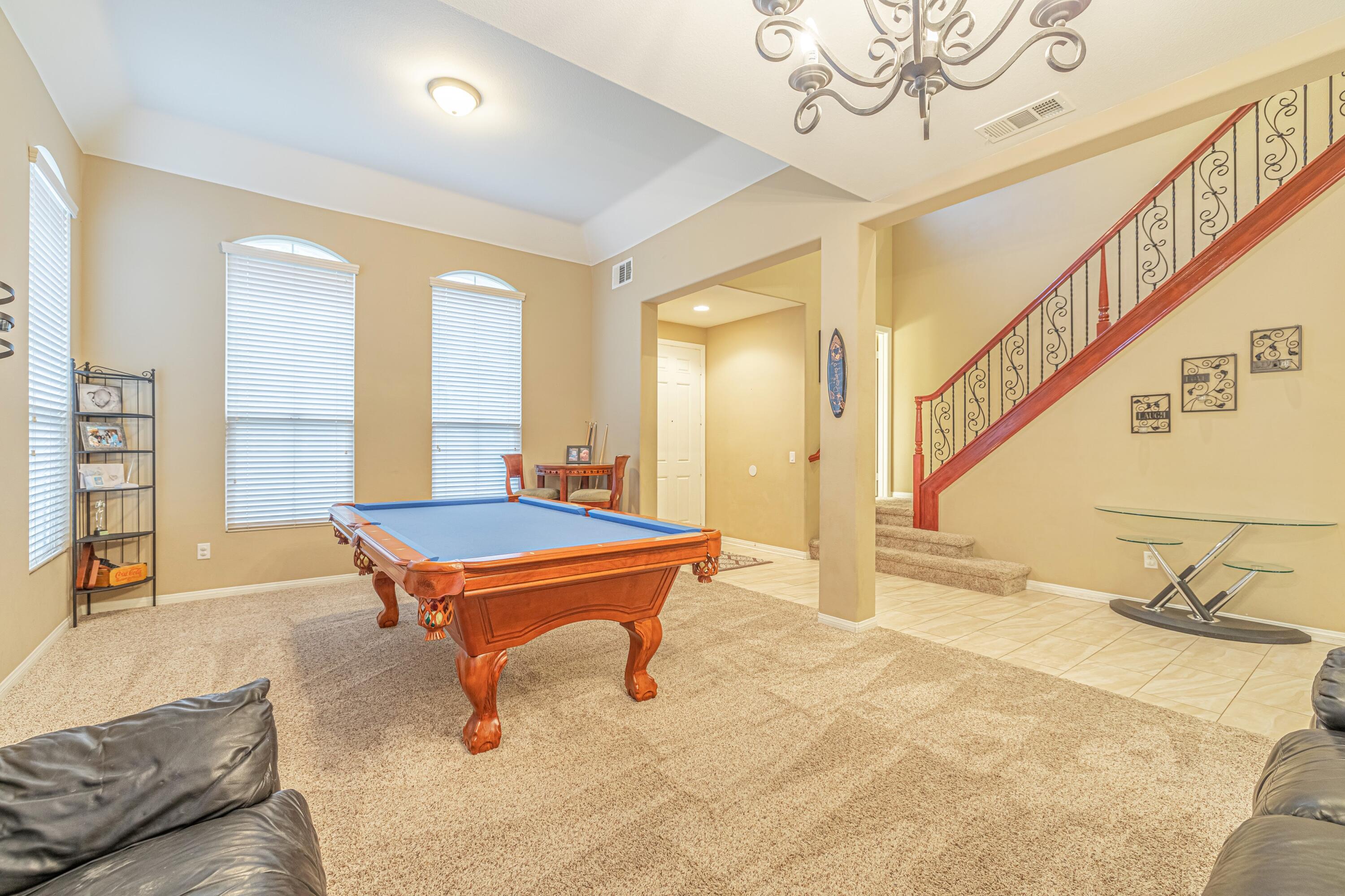 4403 Edam Street Lancaster, CA 93536 - Photo 14 of 42 a room with pool table and windows