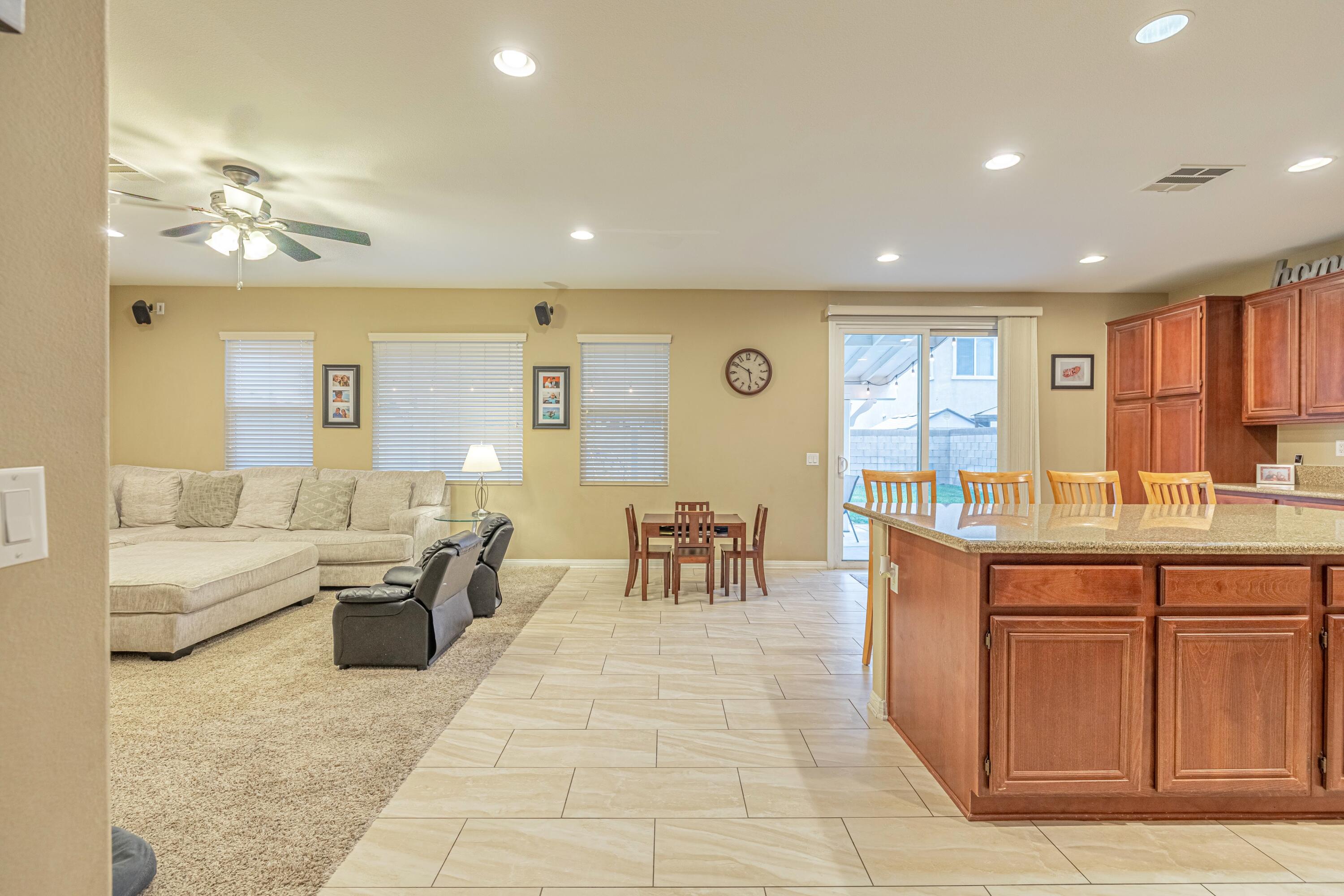 4403 Edam Street Lancaster, CA 93536 - Photo 15 of 42 a living room with lots of furniture and a large window