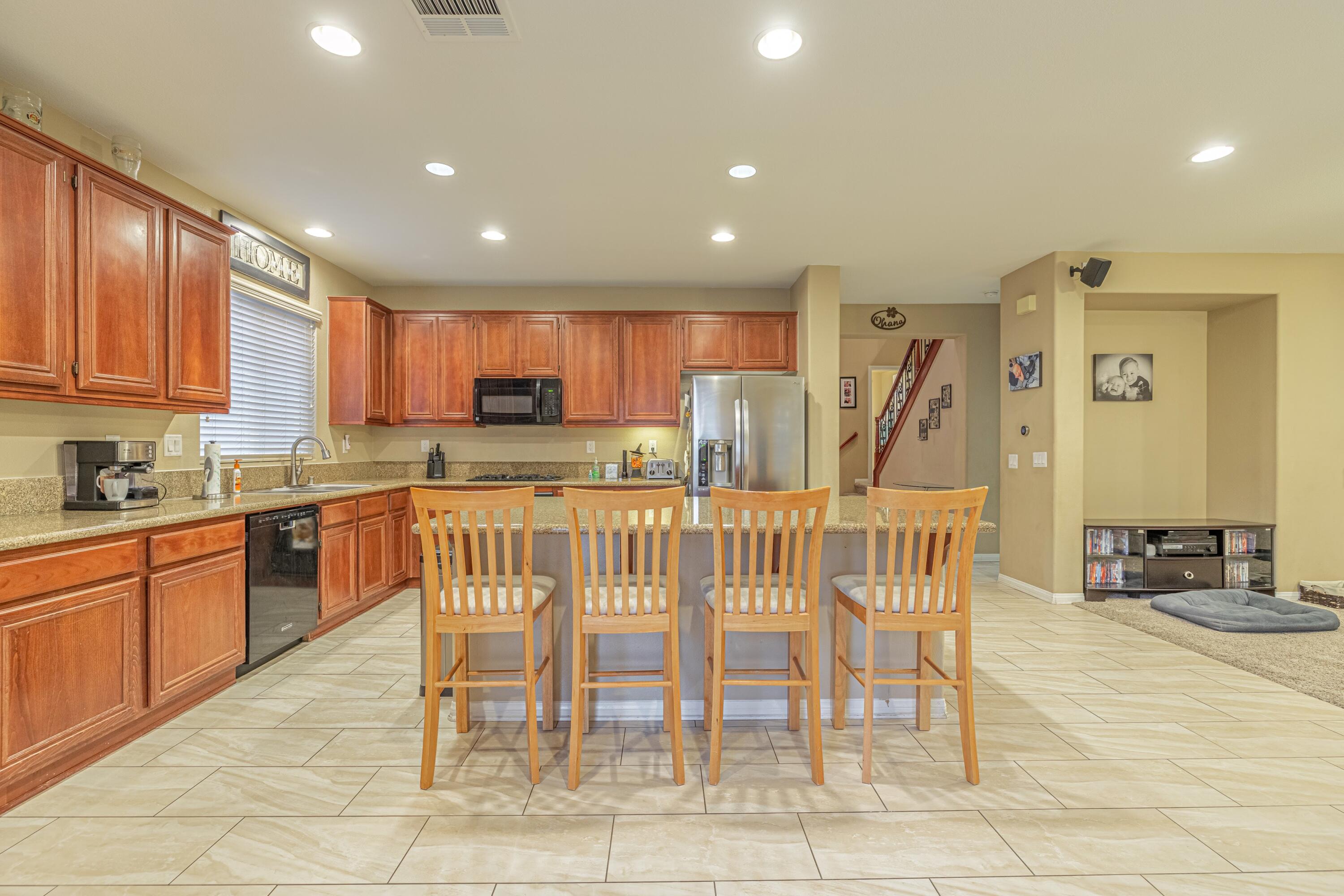 4403 Edam Street Lancaster, CA 93536 - Photo 17 of 42 a view of a dining room with furniture