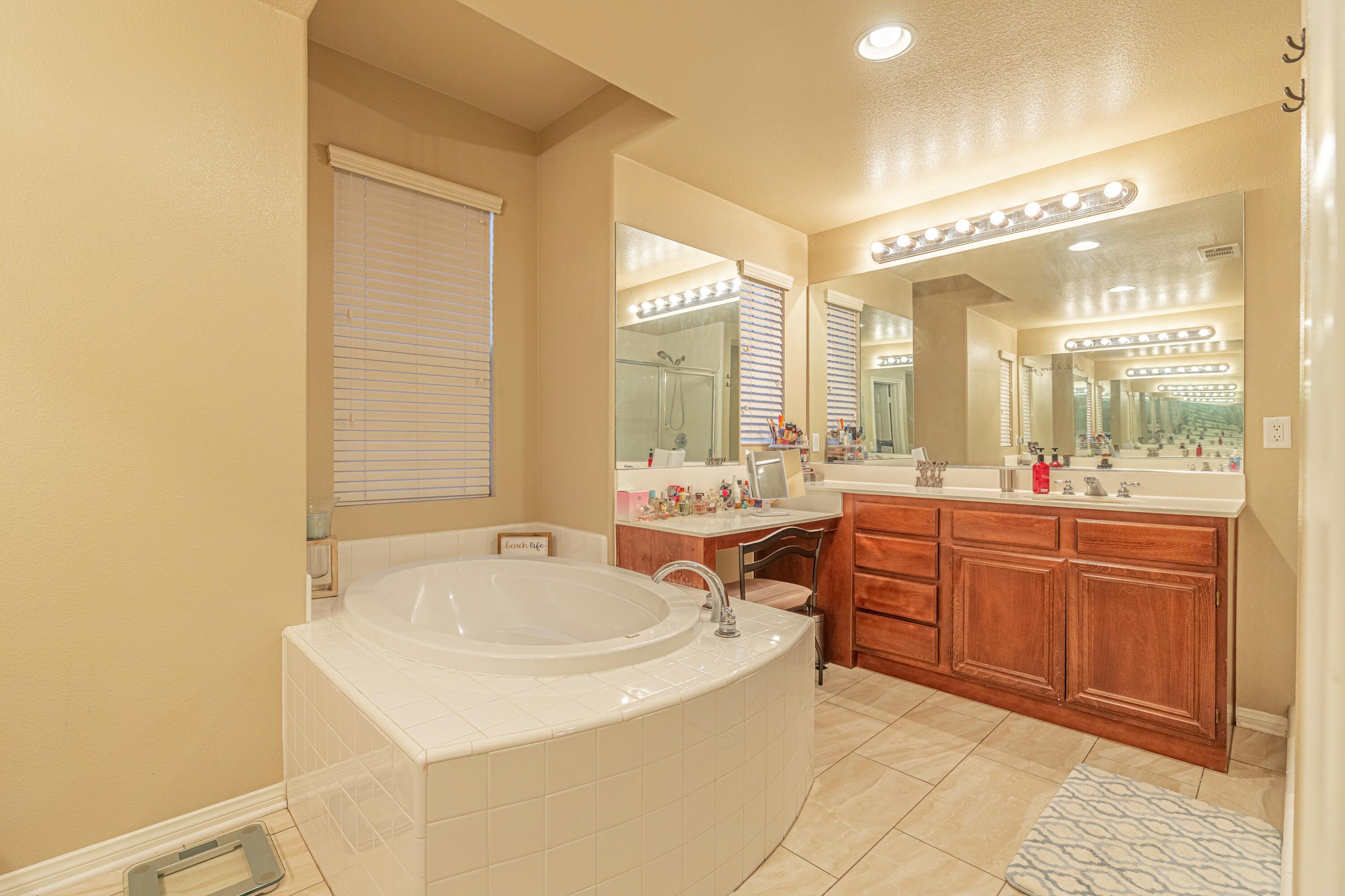 4403 Edam Street Lancaster, CA 93536 - Photo 27 of 42 a bathroom with a sink and a mirror