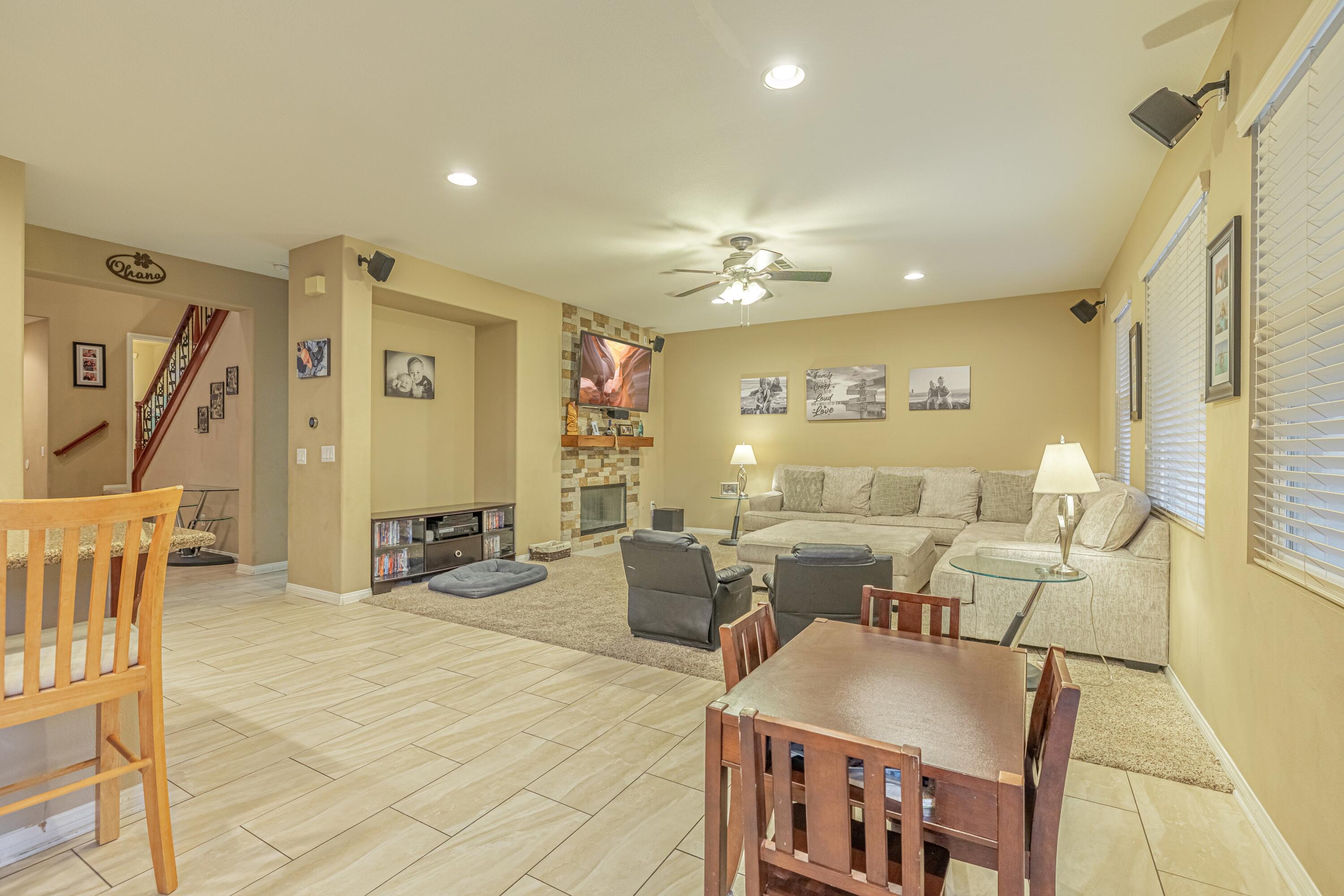 4403 Edam Street Lancaster, CA 93536 - Photo 4 of 42 a living room with lots of furniture and a chandelier
