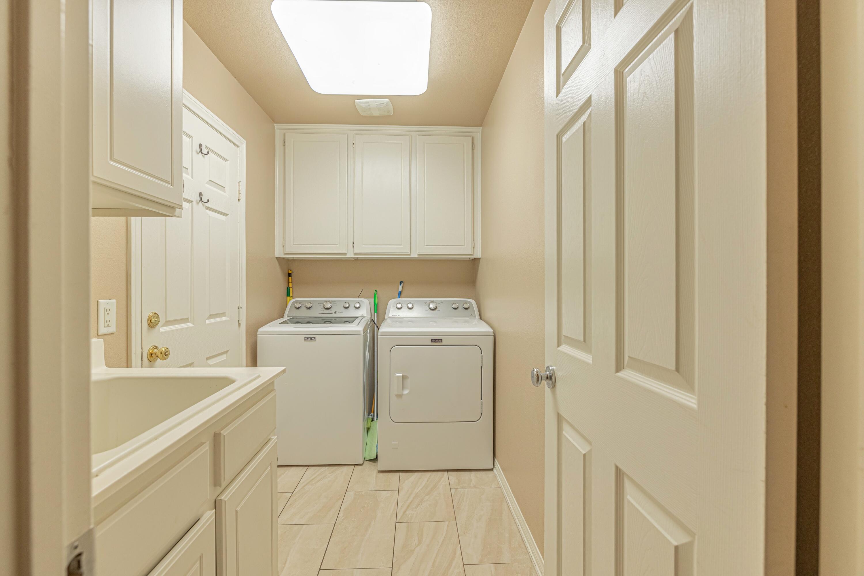 4403 Edam Street Lancaster, CA 93536 - Photo 37 of 42 a utility room with dryer and washer