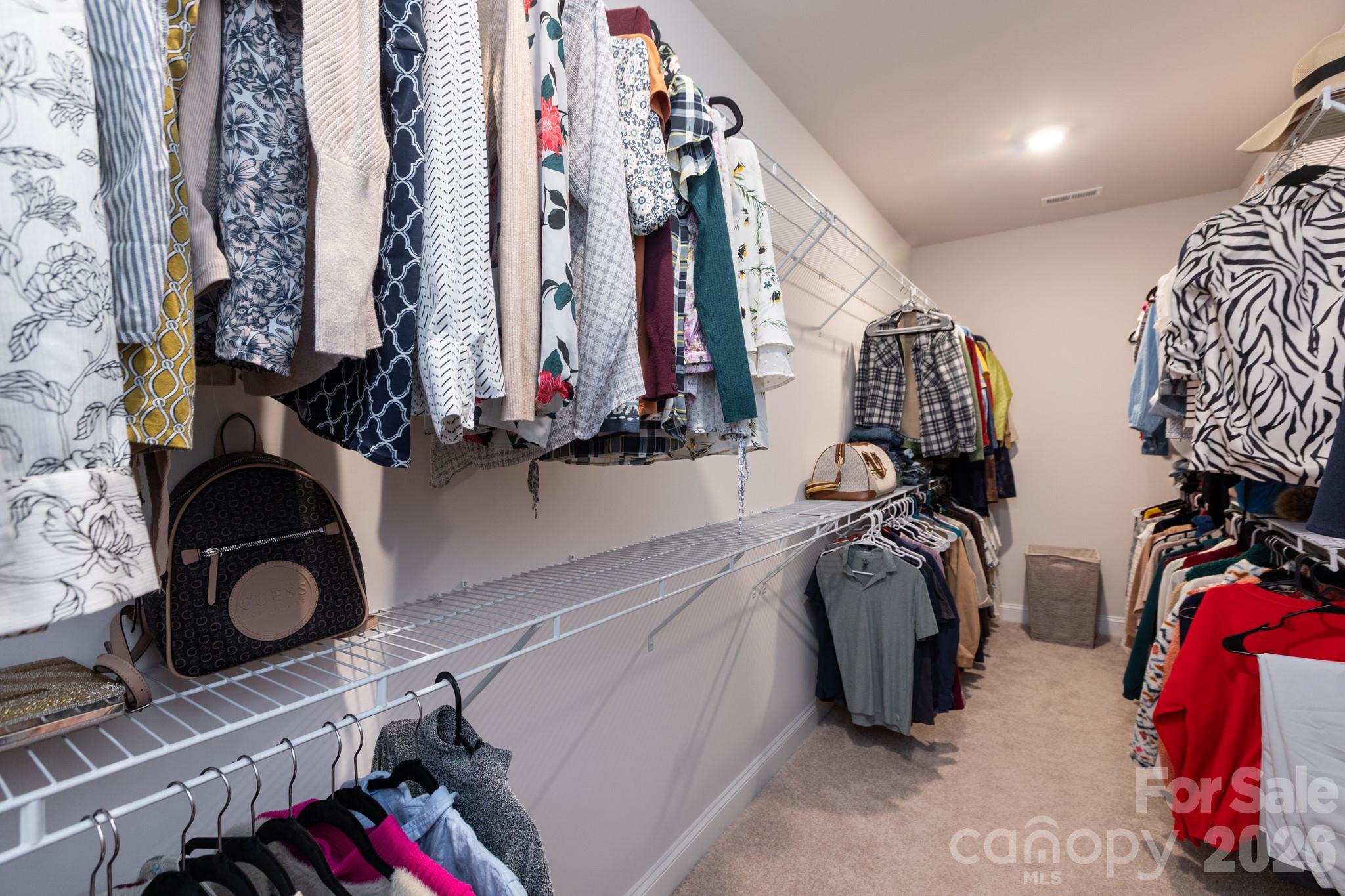 5415 Haystack Avenue Indian Land, SC 29707 - Photo 25 of 44 a view of walk in closet with clothes and shoes