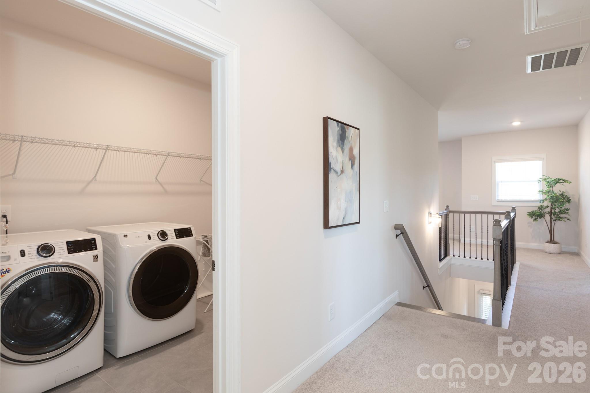5415 Haystack Avenue Indian Land, SC 29707 - Photo 35 of 44 a view of a hallway with washer and dryer