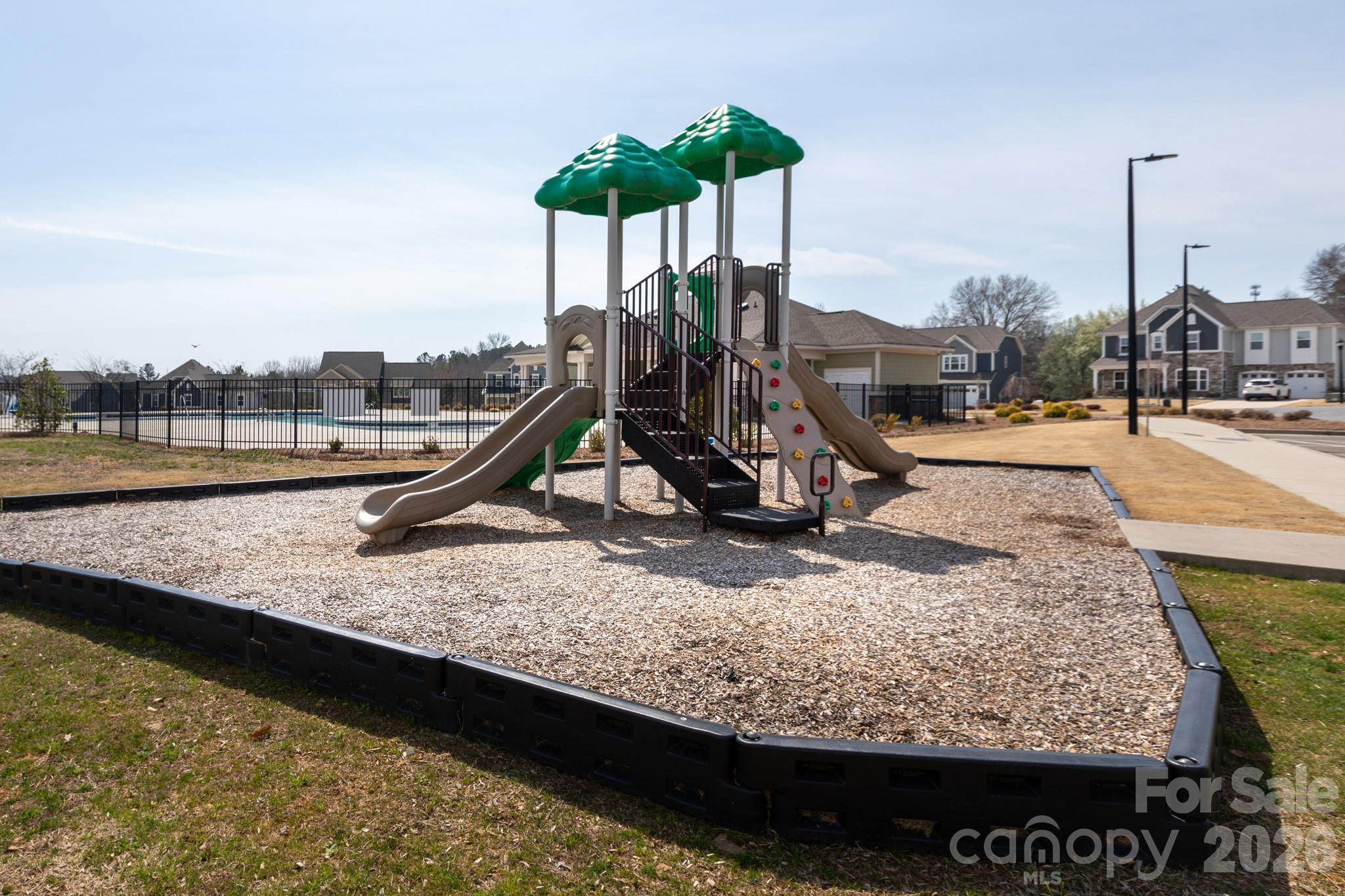 5415 Haystack Avenue Indian Land, SC 29707 - Photo 42 of 44 a view of a swimming pool with a bench and wooden floor