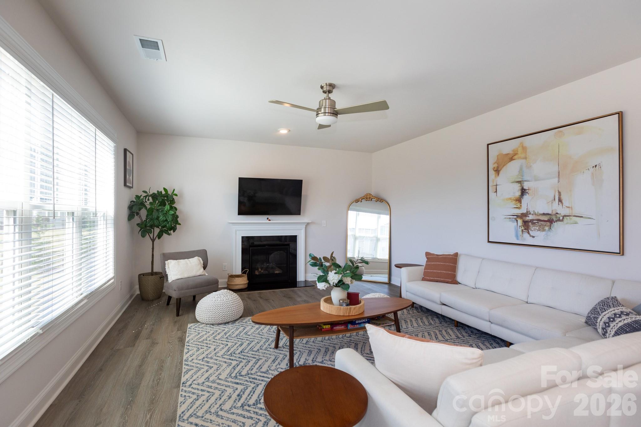 5415 Haystack Avenue Indian Land, SC 29707 - Photo 9 of 44 a living room with furniture a table and a fireplace