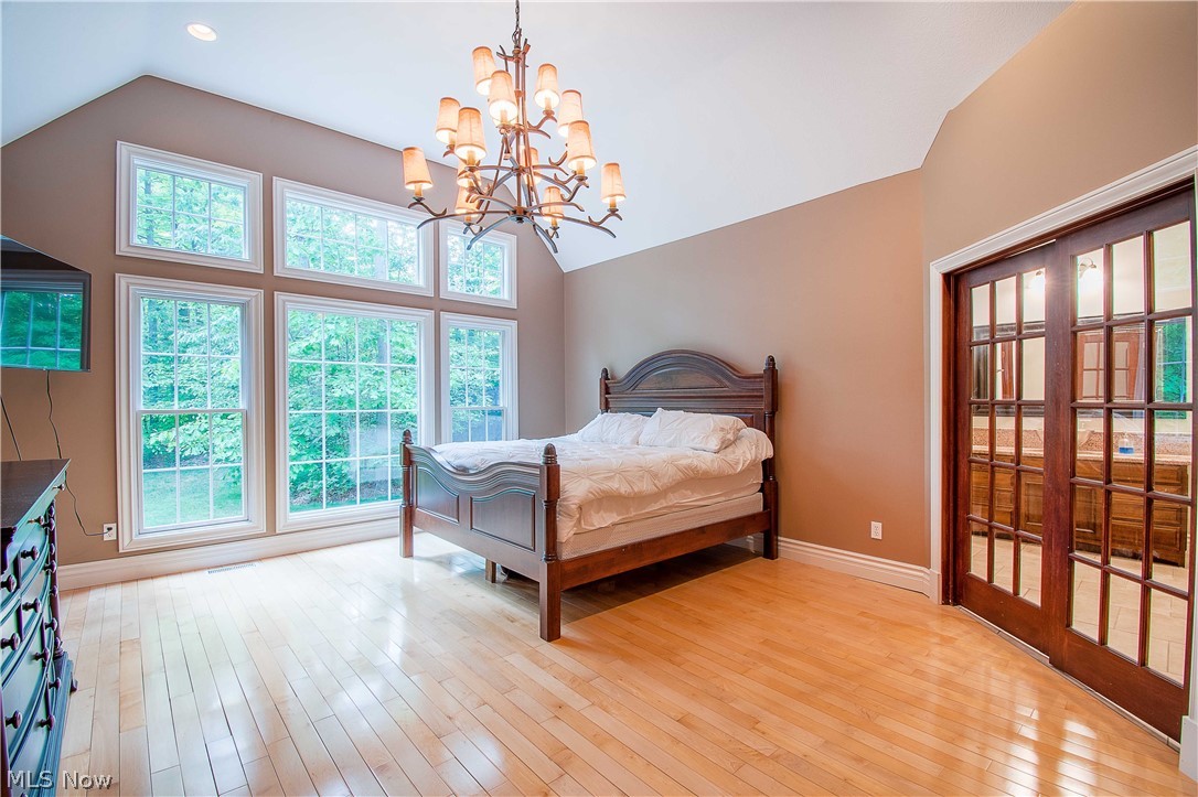 6868 River Styx Road Medina, OH 44256 - Photo 19 of 35 The Highly desired first-floor owner's suite offers a wall of windows with a fabulous view.