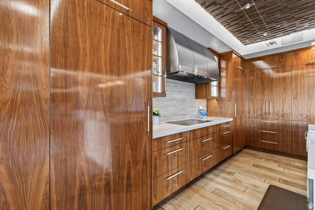 12308 Mariah Circle Draper, UT 84020 - Photo 40 of 293 Contemporary kitchen featuring extensive walnut wood-finish cabinetry with linear hardware