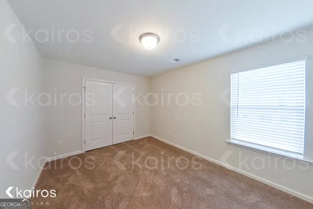 a bathroom with a toilet a sink and shower