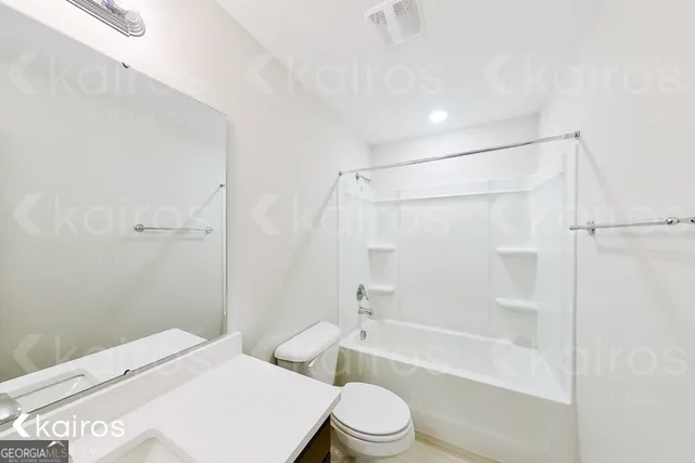 a view of an empty room and a window