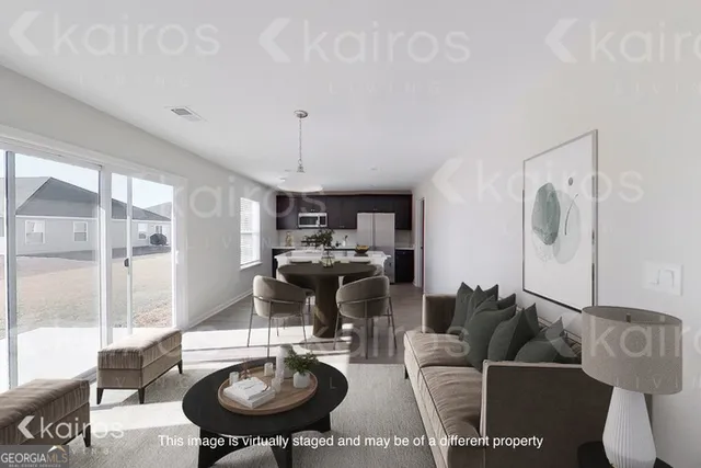 a living room with furniture a window and a table