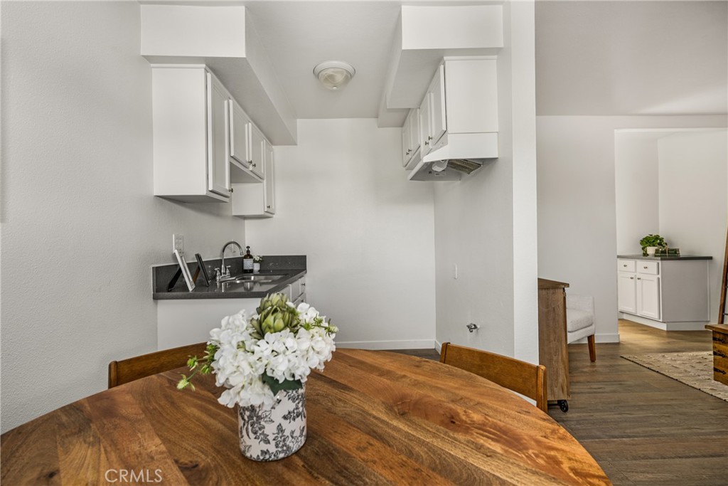 6725 Perry Road Bell Gardens, CA 90201 - Photo 22 of 40 a bedroom with a bed and a chandelier