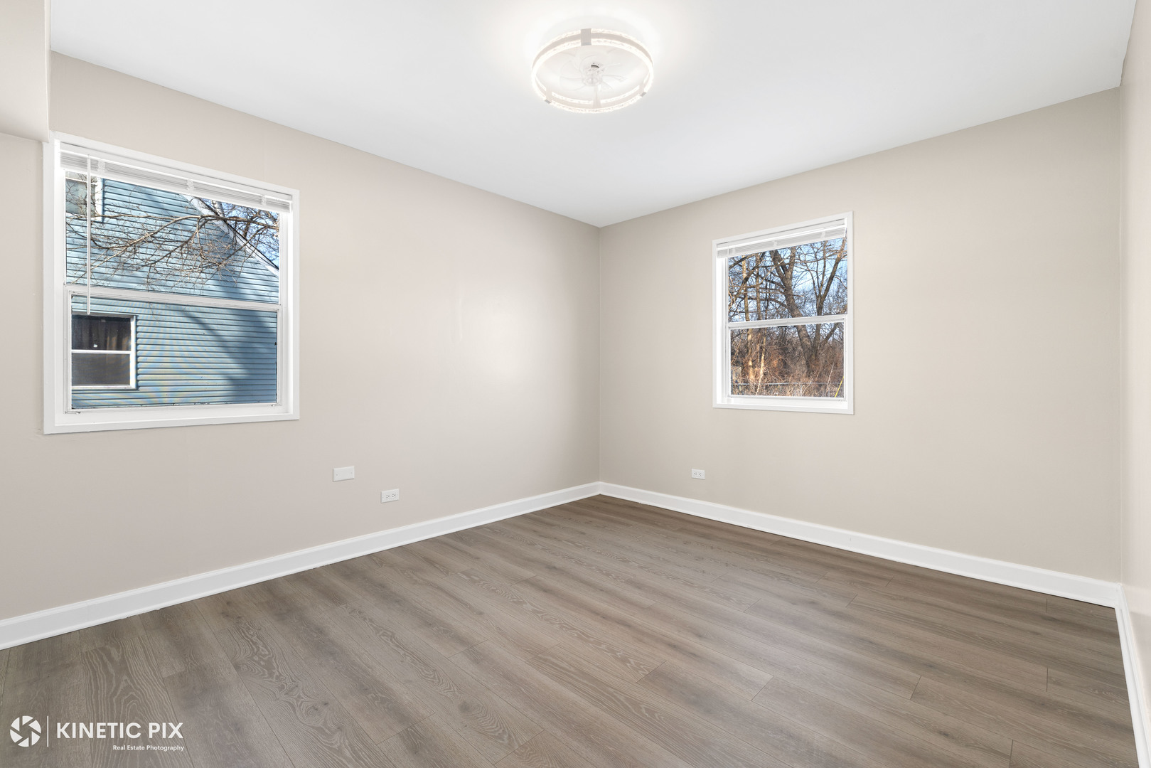 1412 West Broadview Avenue Crete, IL 60417 - Photo 15 of 28 a view of an empty room with wooden floor and a window