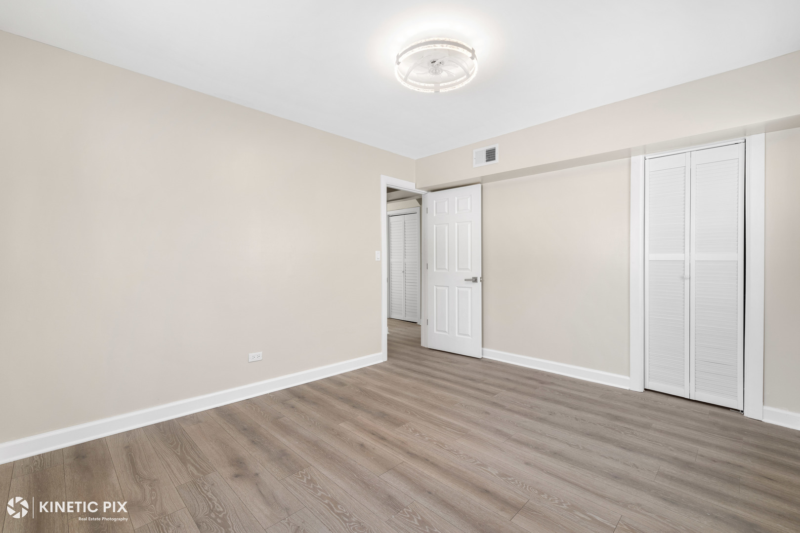 1412 West Broadview Avenue Crete, IL 60417 - Photo 16 of 28 a view of an empty room with wooden floor