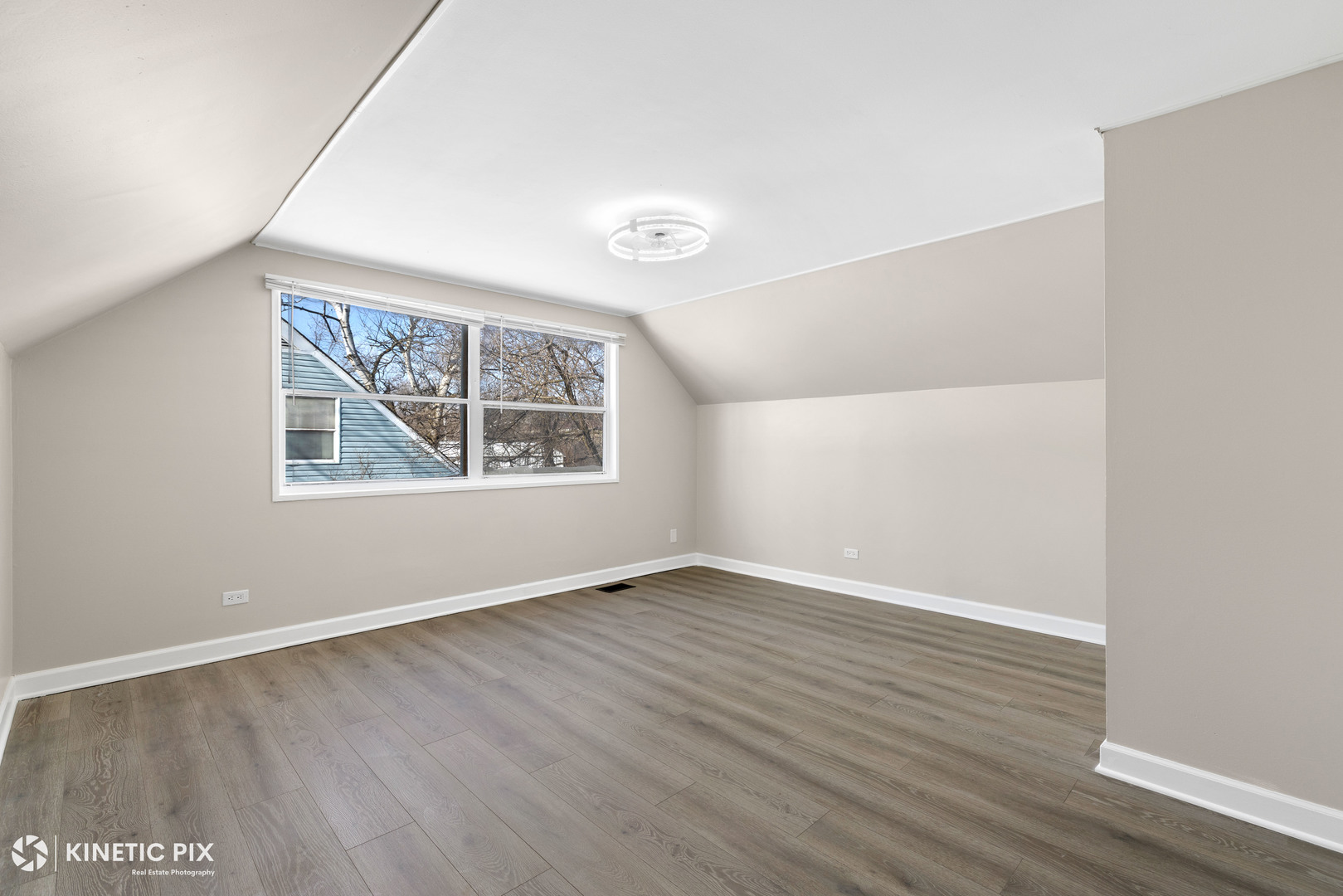 1412 West Broadview Avenue Crete, IL 60417 - Photo 17 of 28 an empty room with wooden floor and windows